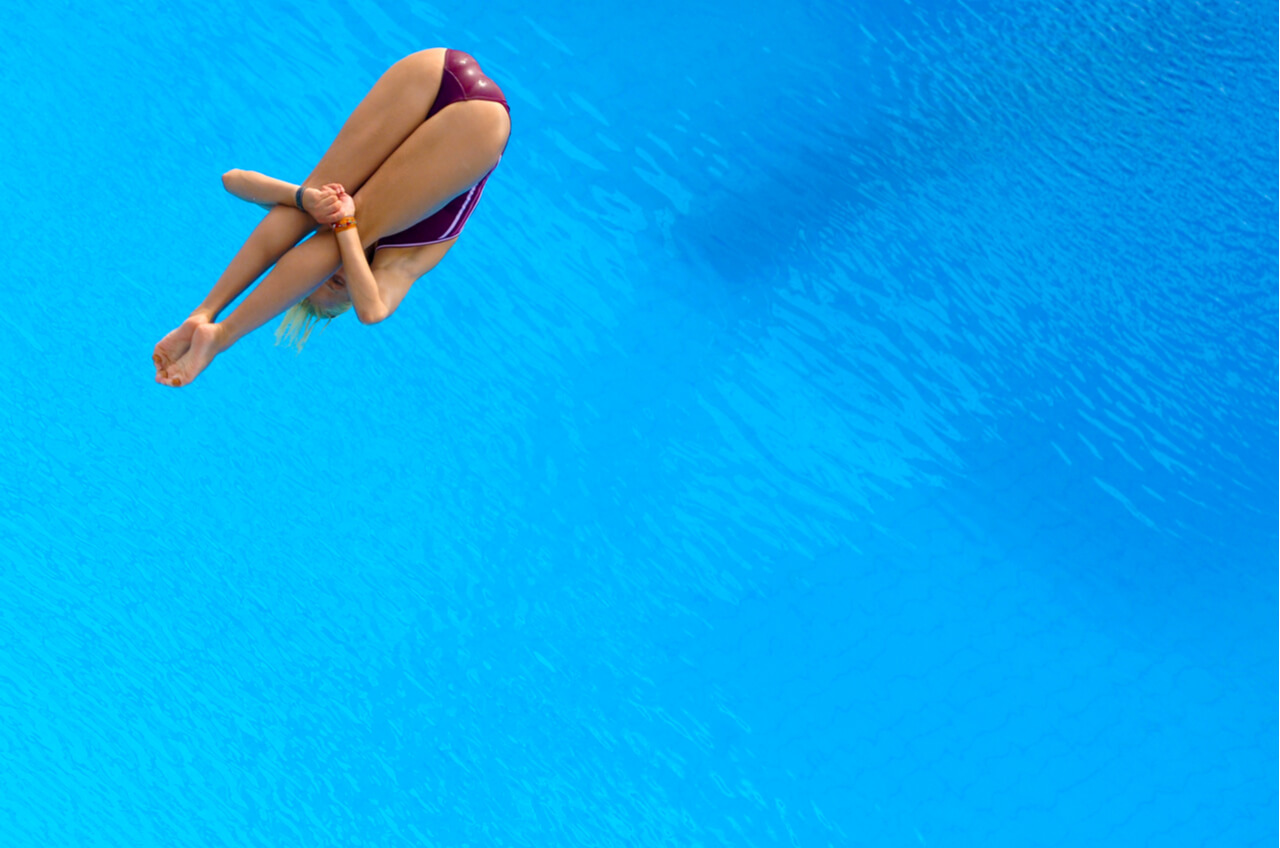 overhead of woman diving into water
